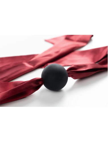 Silicone ball gag with satin straps.